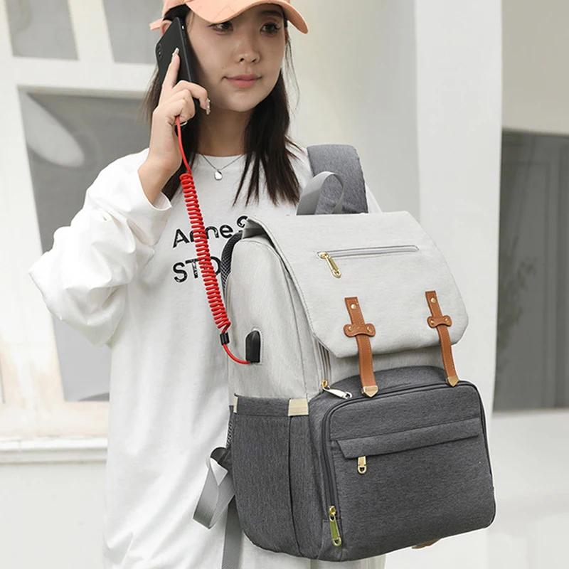 Sac de maman multifonctionnel avec coussin d'air de décompression, sac de mère et de bébé pour sorti