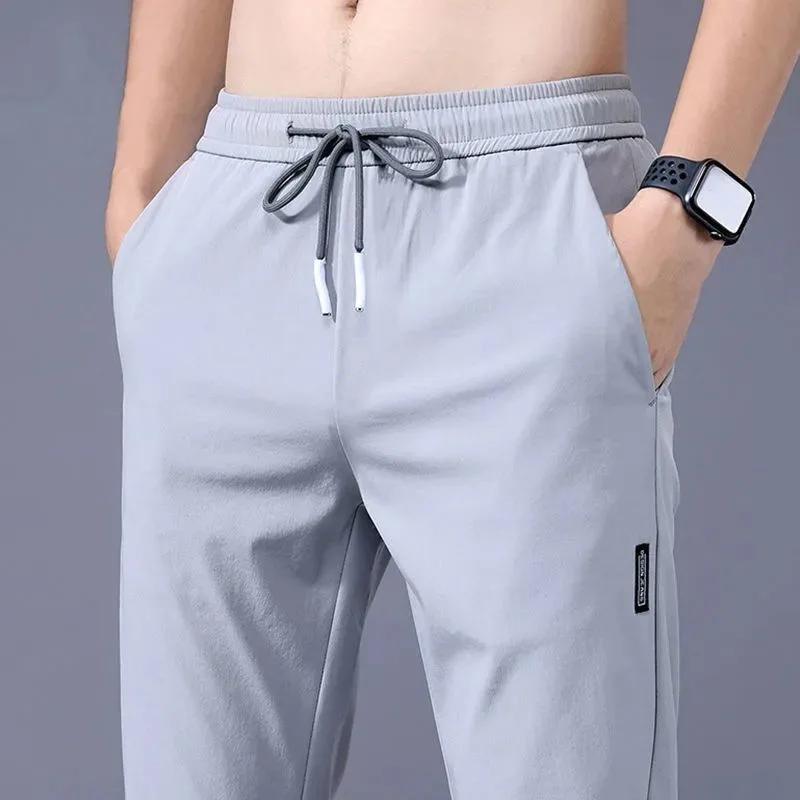 Pantalons pour hommes en soie glacée 2025 été nouveau noir gris mince pantalons décontractés d'affai