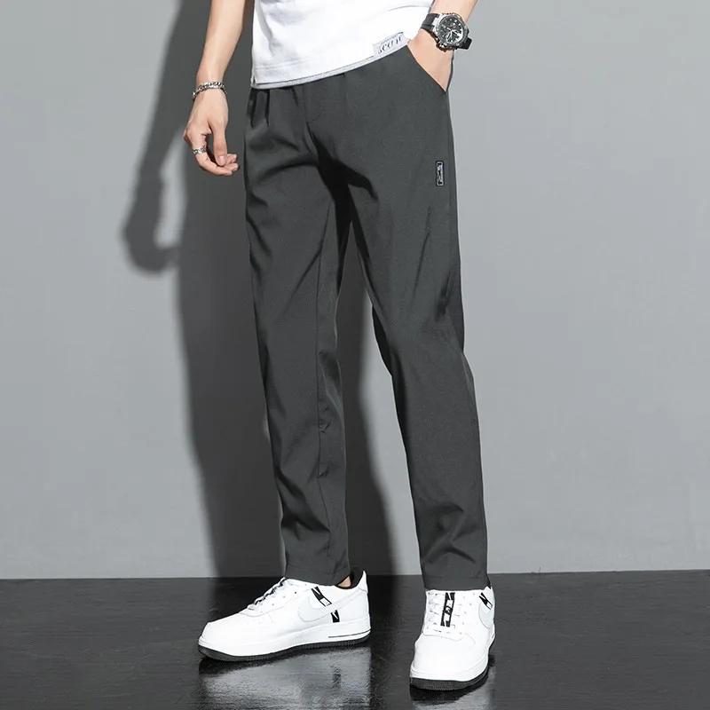 Pantalons pour hommes en soie glacée 2025 été nouveau noir gris mince pantalons décontractés d'affai