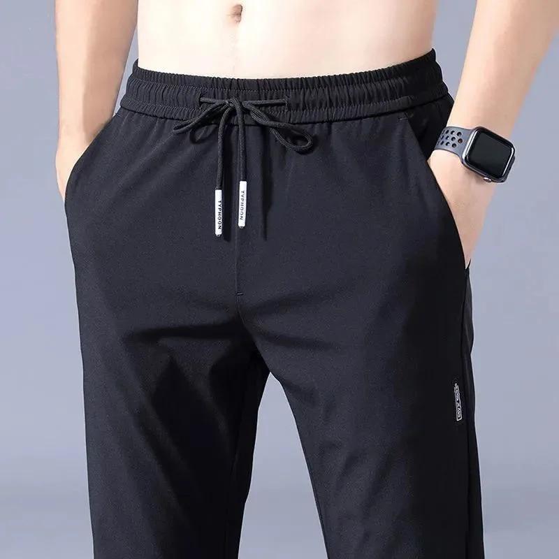 Pantalons pour hommes en soie glacée 2025 été nouveau noir gris mince pantalons décontractés d'affai