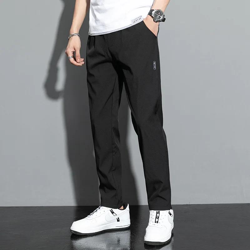 Pantalons pour hommes en soie glacée 2025 été nouveau noir gris mince pantalons décontractés d'affai