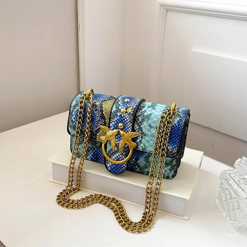 Sac à bandoulière tendance pour femme avec chaîne et blocs de couleur, sac à main élégant à porter s