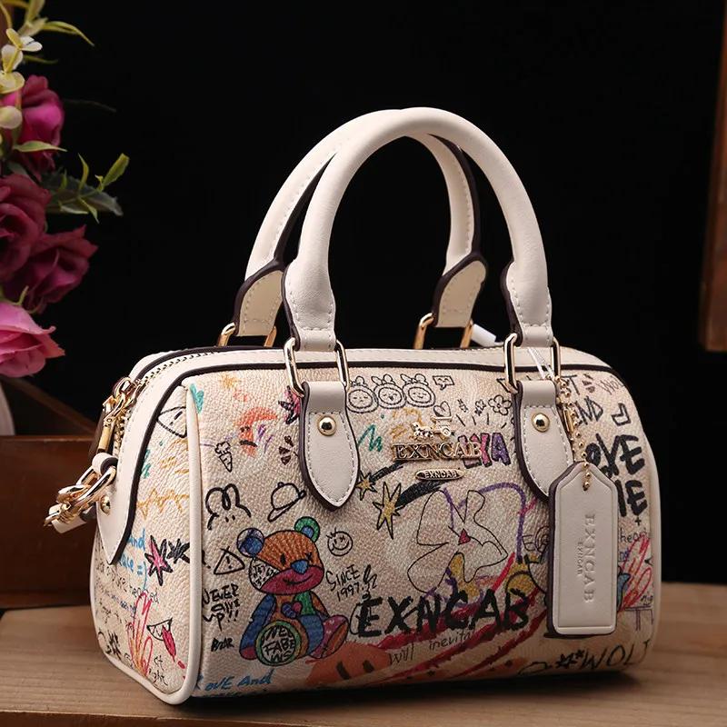 Sac Boston de luxe et vintage à porter à la main avec motifs graffiti de dessins animés tendance et 