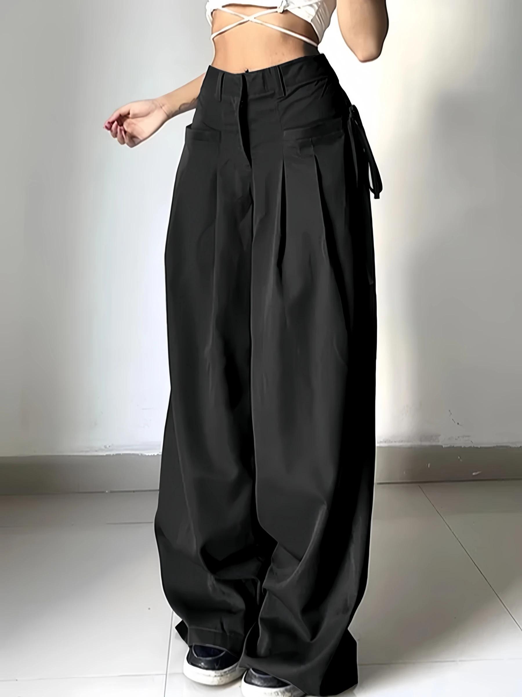 Pantalon de costume noir taille haute pour femme, coupe large, plissé devant, avec détail de nouage