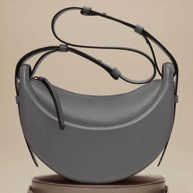 Sac à bandoulière pour femme en cuir véritable, style croissant, design original avec fermeture écla