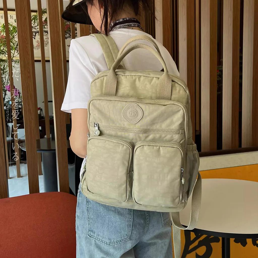 Sac à dos multi-poches pour femmes, sac à dos de voyage en Nylon de couleur unie à poignée souple, l