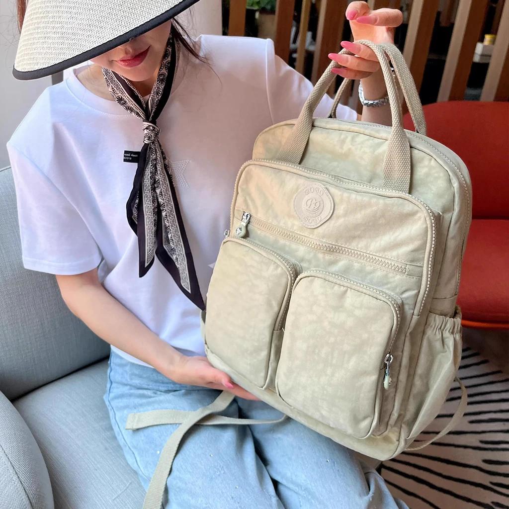 Sac à dos multi-poches pour femmes, sac à dos de voyage en Nylon de couleur unie à poignée souple, l