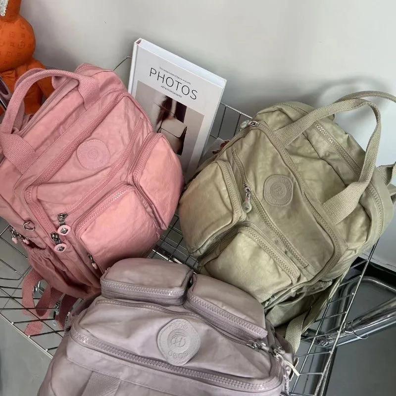 Sac à dos multi-poches pour femmes, sac à dos de voyage en Nylon de couleur unie à poignée souple, l