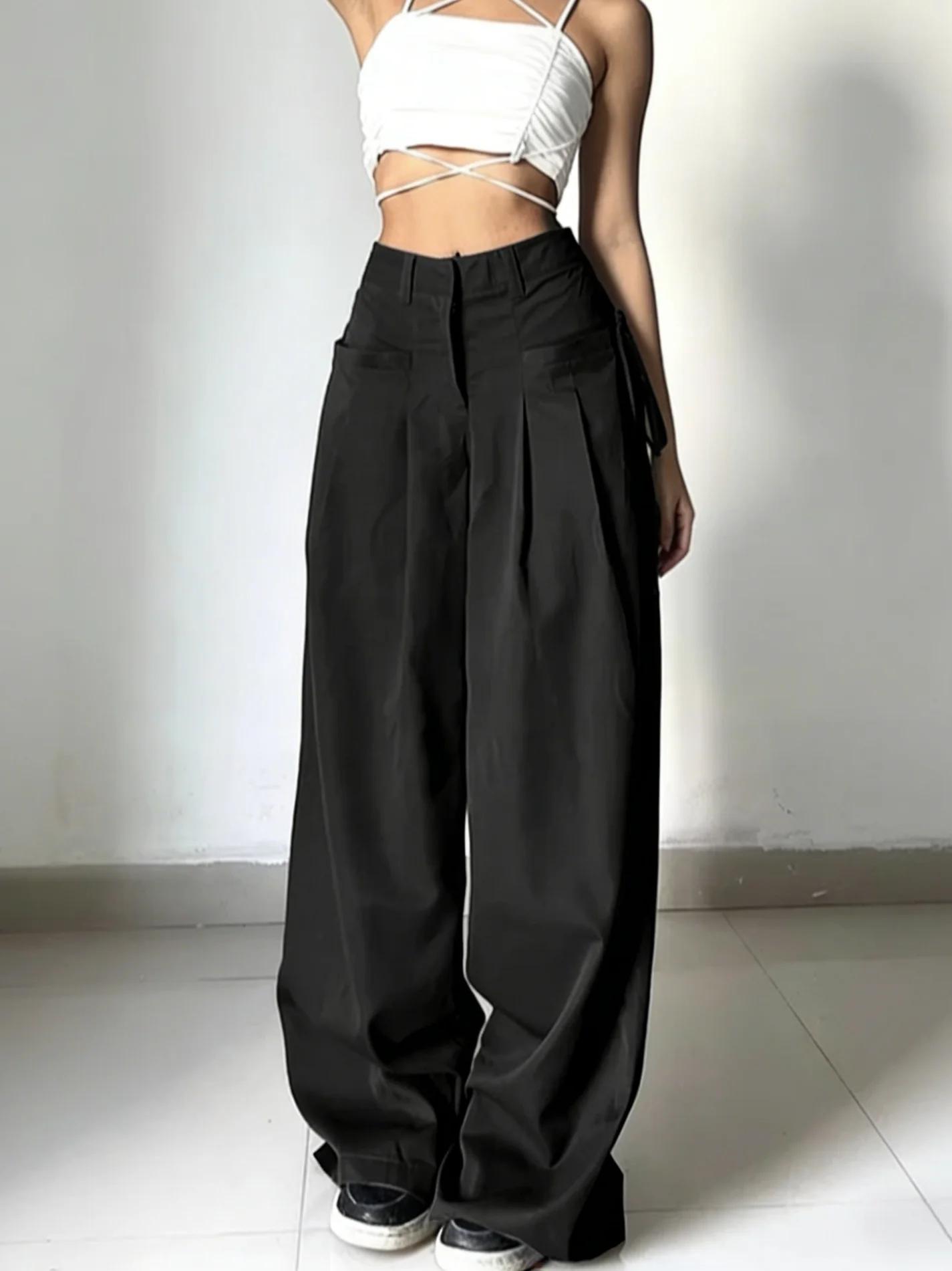 Pantalon de costume noir taille haute pour femme, coupe large, plissé devant, avec détail de nouage