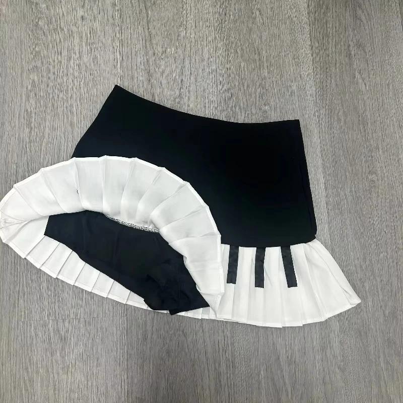 Printemps noir blanc épissé femmes jupe courte Y2k conception mince Harajuku Mini jupe femme Empire