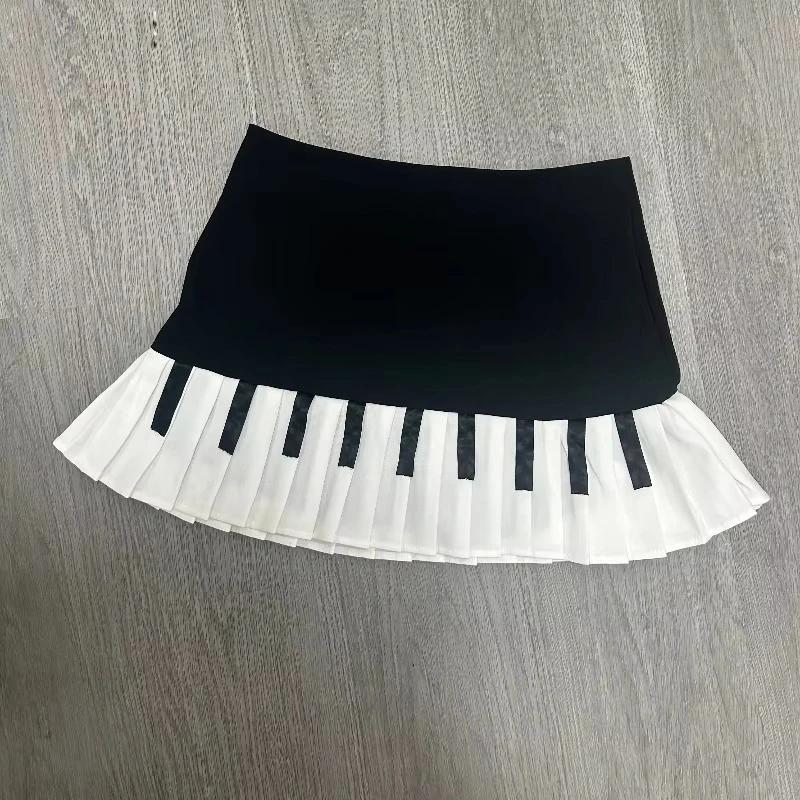Printemps noir blanc épissé femmes jupe courte Y2k conception mince Harajuku Mini jupe femme Empire