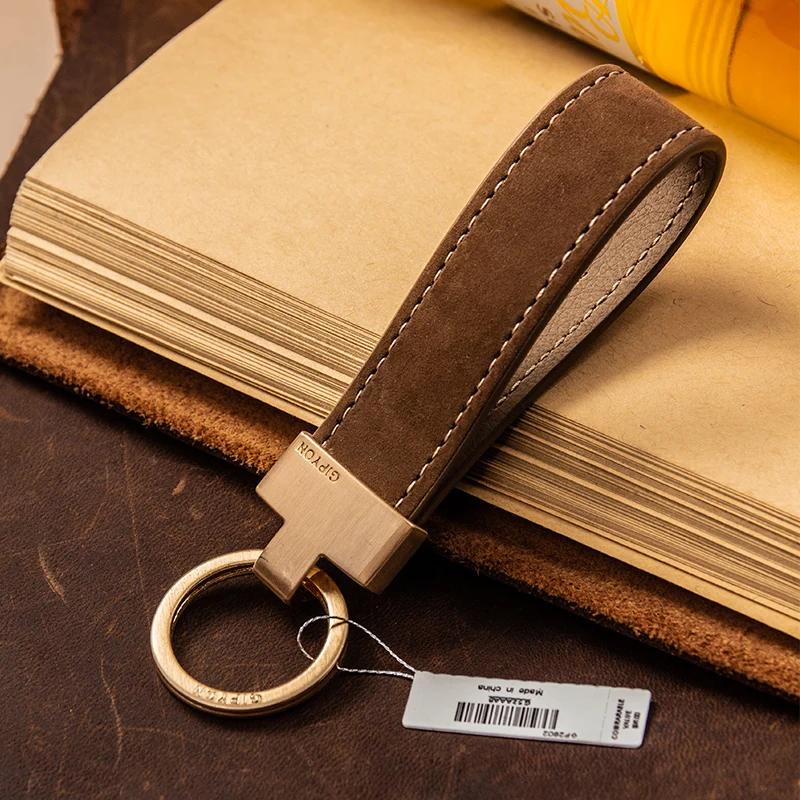 Corde de poignée exquise de haute qualité, pendentif de porte-clés Simple en peau de vache, anneau d