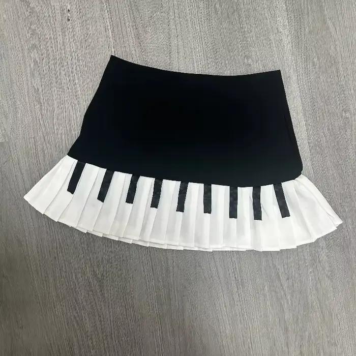 Printemps noir blanc épissé femmes jupe courte Y2k conception mince Harajuku Mini jupe femme Empire