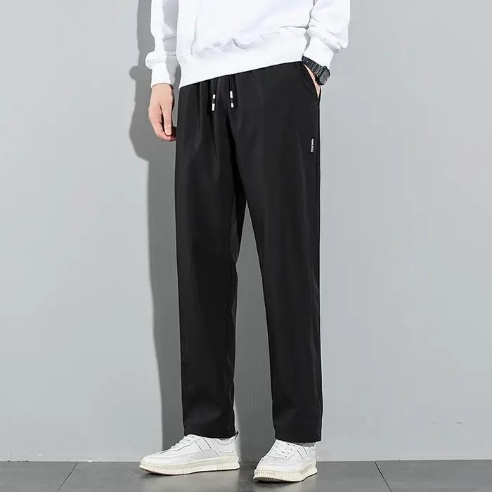Pantalons pour hommes en soie glacée 2025 été nouveau noir gris mince pantalons décontractés d'affai