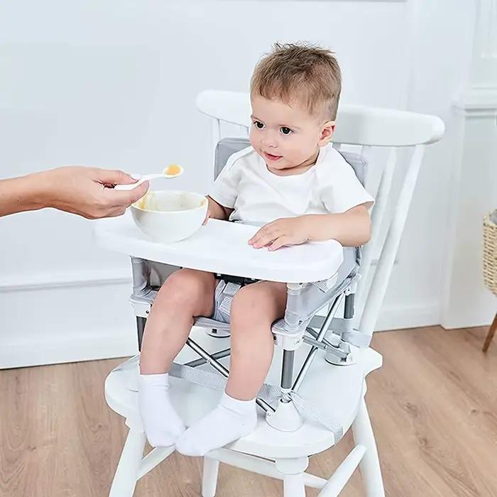 Chaise d'appoint portable ergonomique pour bébé confortable pour repas de famille et sorties en extérieur
