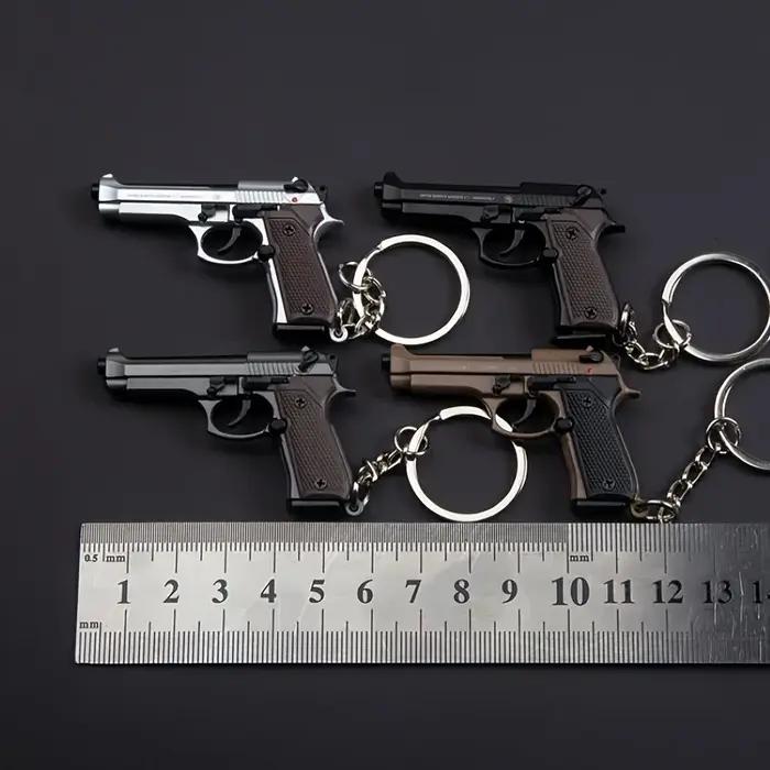 Porte-clés Pistolet Tactique 2025 - Modèle de Pistolet en Alliage 1:4 avec Pompons et Couvercle Tran
