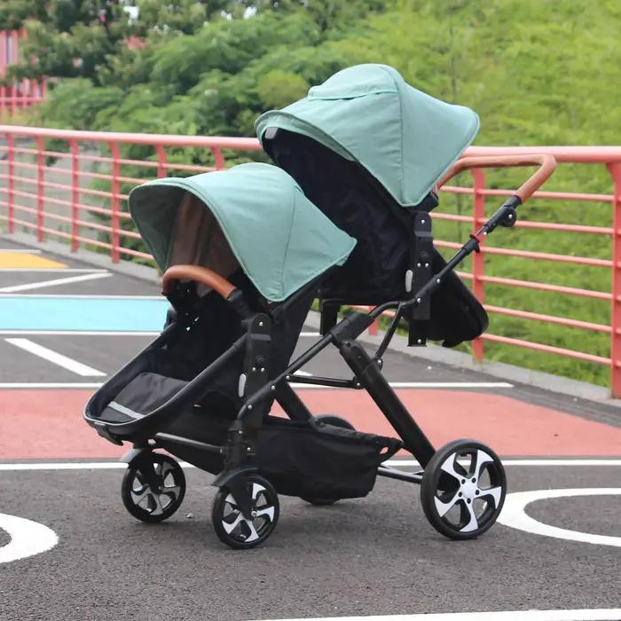 2025 Nouvelle poussette trois-en-un jumeaux avec siège auto, pliable, légère, équipée de cadeaux