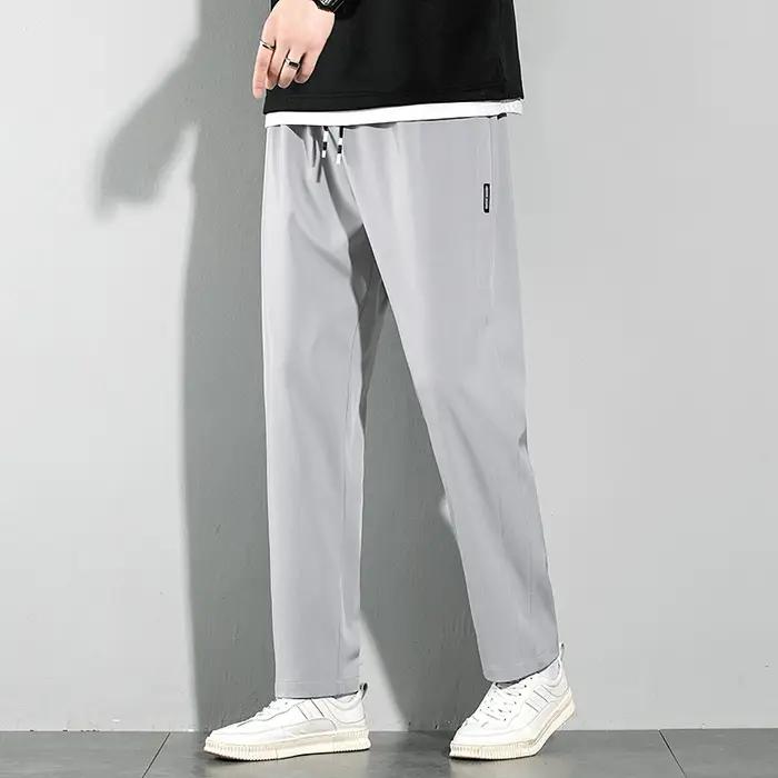 Pantalons pour hommes en soie glacée 2025 été nouveau noir gris mince pantalons décontractés d'affai