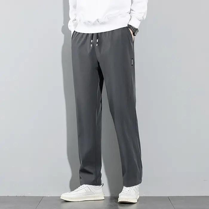 Pantalons pour hommes en soie glacée 2025 été nouveau noir gris mince pantalons décontractés d'affai