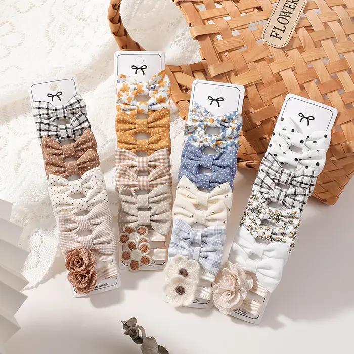 Bébé arcs 20 pièces/ensemble tissu fait à la main imprimé Barrette Boutique Mini Boutique frange arc
