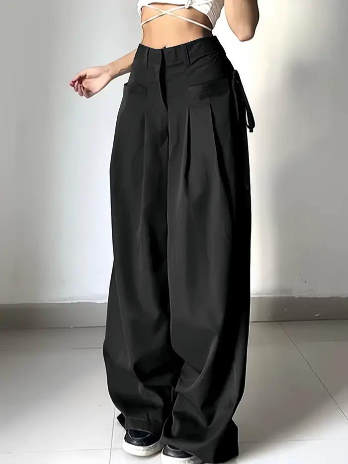 Pantalon de costume noir taille haute pour femme, coupe large, plissé devant, avec détail de nouage