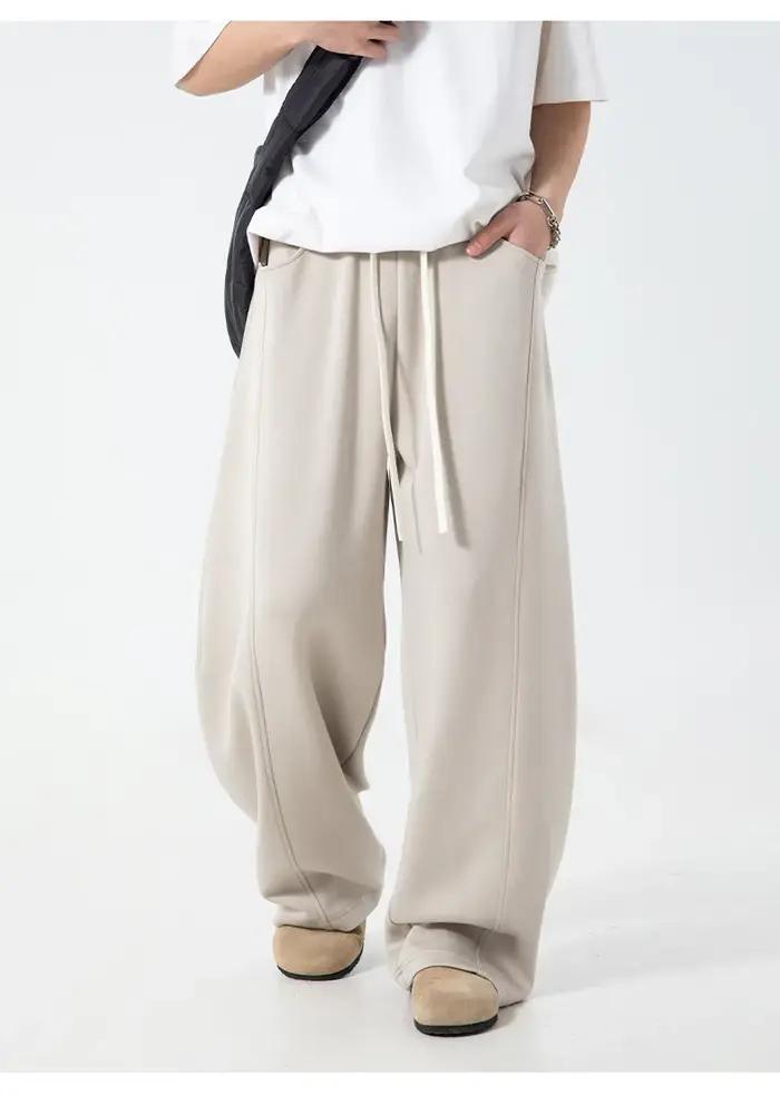 Pantalon décontracté texturé à coutures fendues pour hommes, surdimensionné, jambes incurvées, drapé